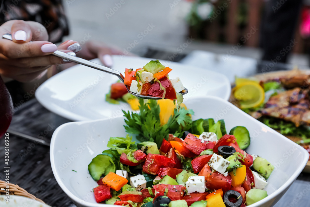 Person Eating Green Salad With a Fork Person Eating Green Salad With a Fork