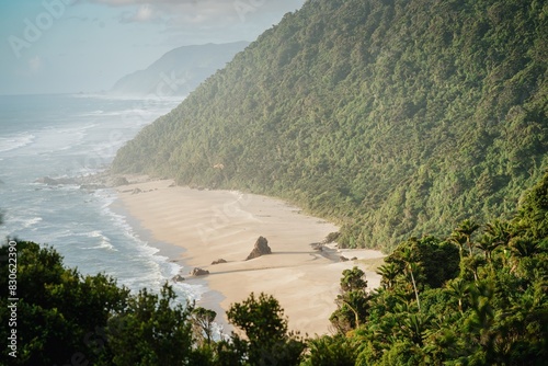 Sandy ocean and waves of Scotts Beach on the Heaphy Track, Karamea, West Coast, New Zealand. photo
