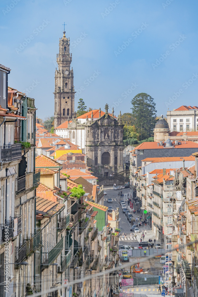 View of a street in the historic city center of Porto with the Church and Torre dos Clérigos in the background.