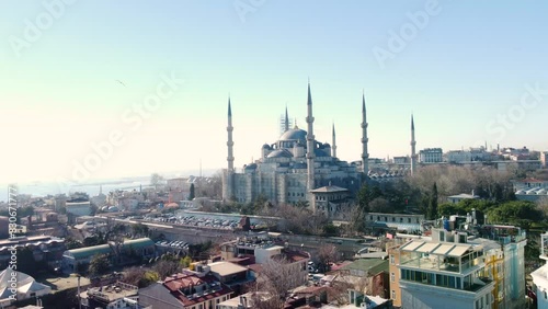 Iconic Blue Mosque in Istanbul, Turkey, with its majestic domes, minarets, lining up  the cityscape landmarks. Aerial drone footage, Istanbul, Turkey - İstanbul, Türkiye photo