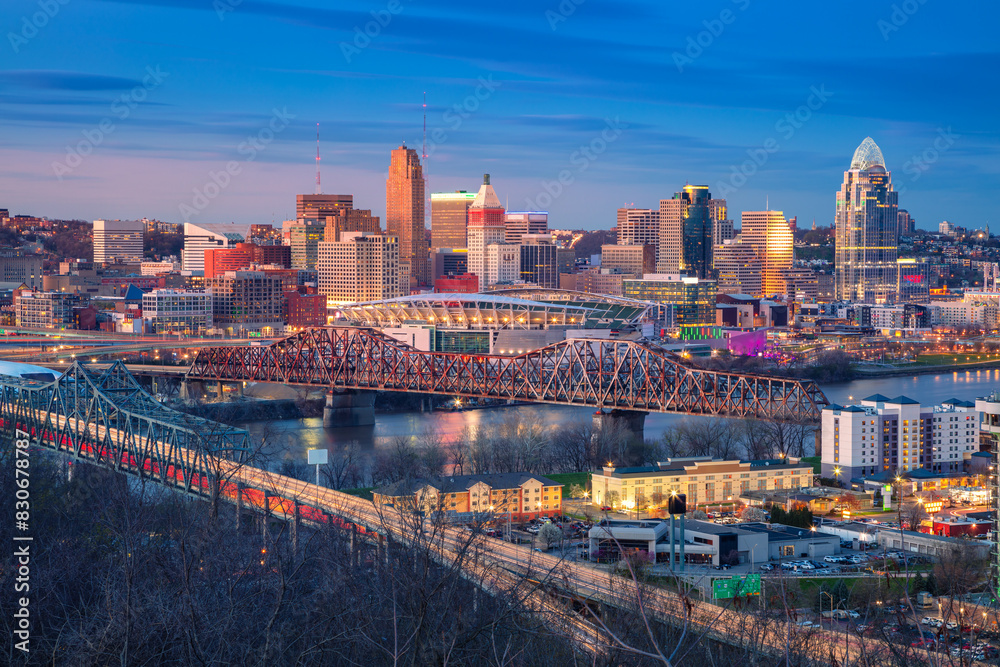 Cincinnati, Ohio, USA. Aerial cityscape image of Cincinnati, Ohio, USA downtown skyline with bridges and Ohio River at spring sunset.