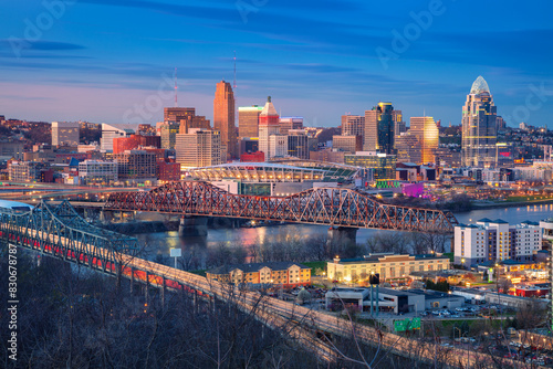 Cincinnati, Ohio, USA. Aerial cityscape image of Cincinnati, Ohio, USA downtown skyline with bridges and Ohio River at spring sunset. photo
