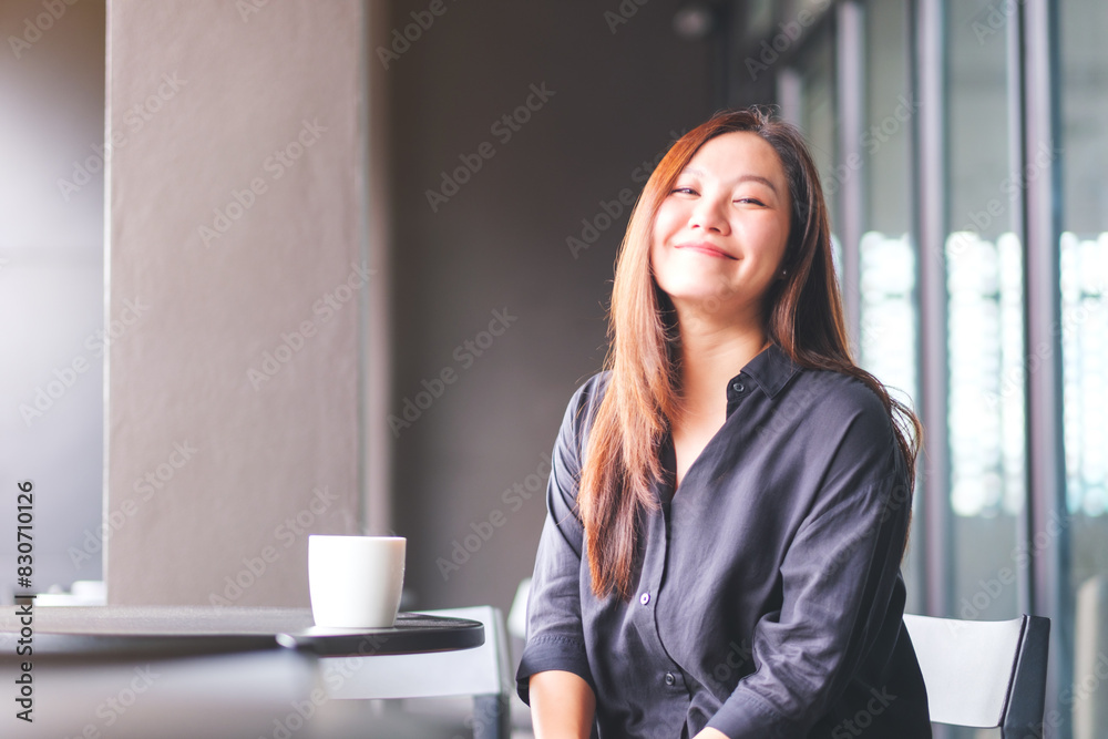 Portrait image of a beautiful young asian woman in cafe Portrait image of a beautiful young asian woman in cafe