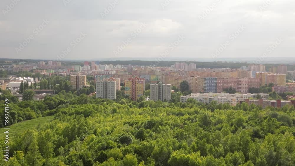 Panoramic view of a 70's urban housing estate in Ostrava behind a large green area under an overcast sky Panoramic view of a 70's urban housing estate in Ostrava behind a large green area under an overcast sky