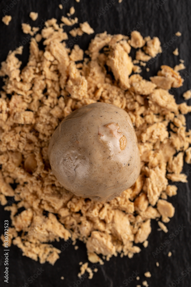 A ball of peanut halva-flavored ice cream A ball of peanut halva-flavored ice cream