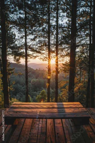 Sunset view from a forest deck, landscape shot with golden hues, minimalistic style
