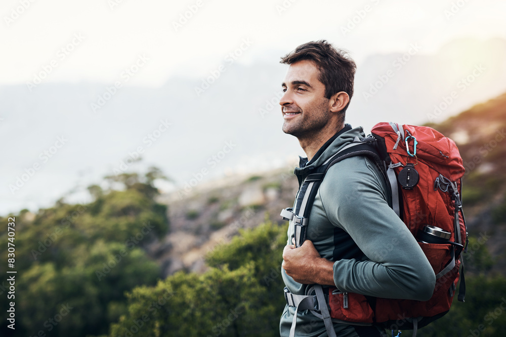 Man, backpack and thinking in nature forest for wilderness experience, exploration and solitude for stress relief or mental health. Guy, outdoor and hiking in woods for adventure or physical exercise