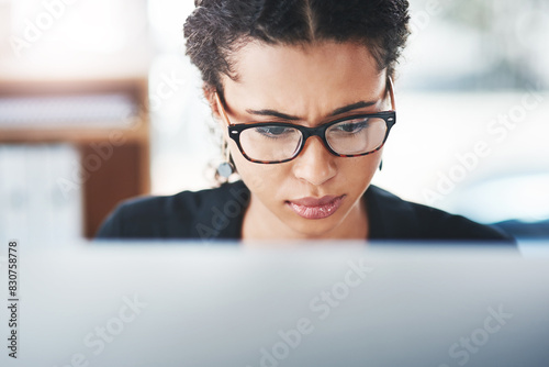 Thinking, worry and business woman with laptop in office confused by report, feedback or review. Questions, unsure and girl manager with reading glasses for online, glitch or concerned by 404 error