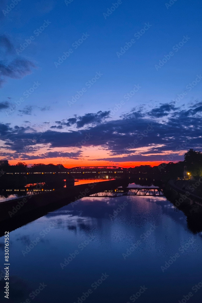 Stunning Sunset Over River with Dramatic Cloudscape and Reflections Perfect for Wall Art or Travel Posters Stunning Sunset Over River with Dramatic Cloudscape and Reflections Perfect for Wall Art or Travel Posters