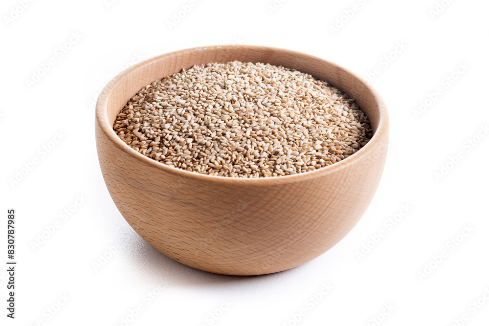 sesame seeds in a wooden bowl isolated on white background sesame seeds in a wooden bowl isolated on white background