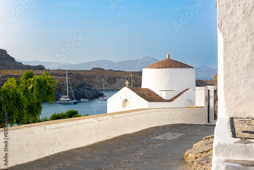 typical panoramic Greek street with chapel,  summer holiday destination of Lindos Rhodes