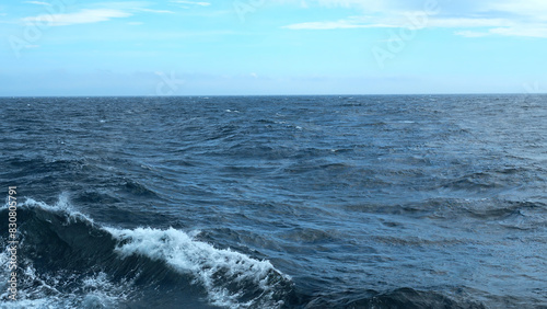 Waves from floating sea vessel. Clip. Beautiful moving waves from floating ship at sea. Beautiful sea horizon with moving waves from ship