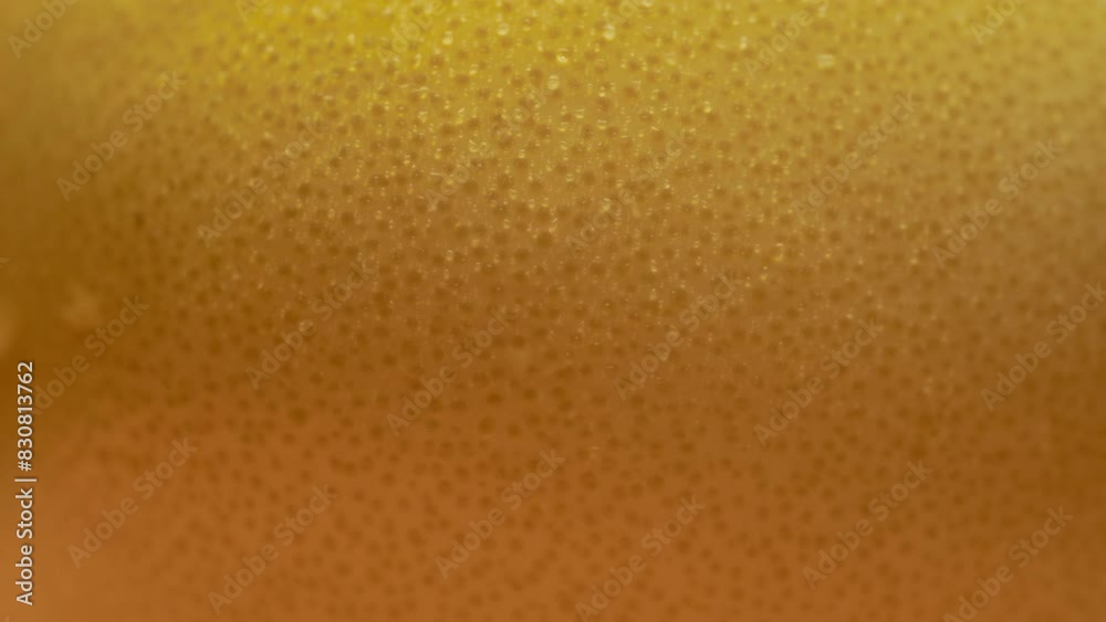 Water being sprayed on the surface of an orange. Fruit texture macro background. 