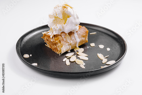 apple strudel with vanilla ice cream on plate photo