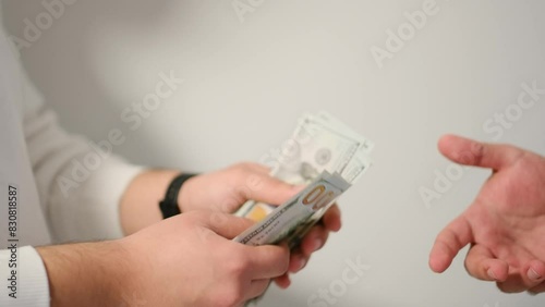 men exchanging money in close-up