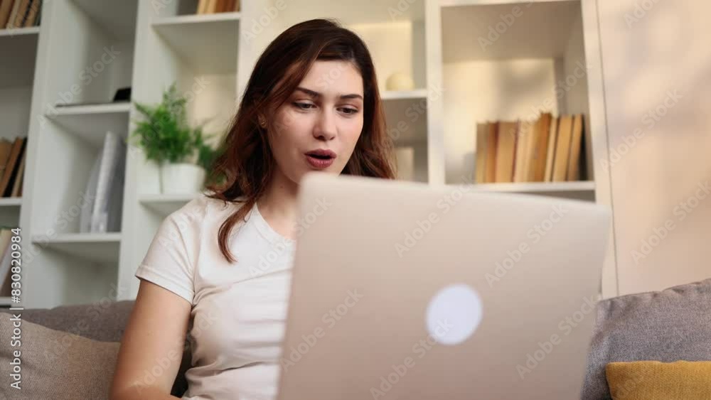 Portrait of beautiful young caucasian woman having video call conference meeting by laptop computer at home Smiling female talking on personal conversation indoors Distance relationship concept Portrait of beautiful young caucasian woman having video call conference meeting by laptop computer at home Smiling female talking on personal conversation indoors Distance relationship concept
