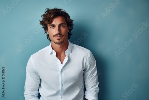 Portrait of a handsome young man in a white shirt. Men s beauty  fashion.