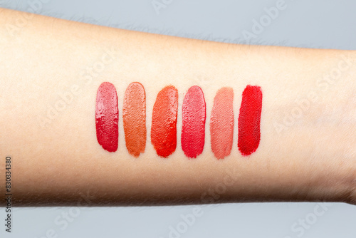 Wallpaper Mural Lipstick swatches on arm woman isolated in bright background. Test cosmetic color shade beauty and fashion concept. Torontodigital.ca