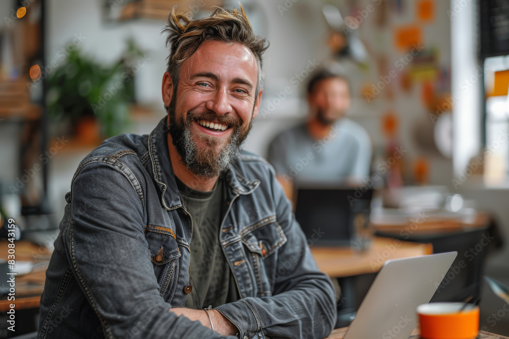 Man working at table with laptop Man working at table with laptop