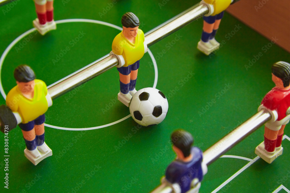Ball and figures on the foosball table, Close-up view Ball and figures on the foosball table, Close-up view