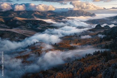 A picturesque view of a valley covered in clouds. Perfect for landscape backgrounds
