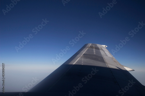 Blue Sunrise Sky View from Airplane Window. Travel, Tourism. Global Transportation. 