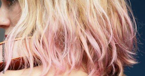 Focused violinist, bare shoulders, black concert dress