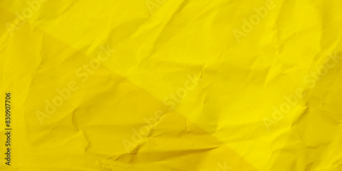 Yellow background and wallpaper by crumpled paper texture and free space.