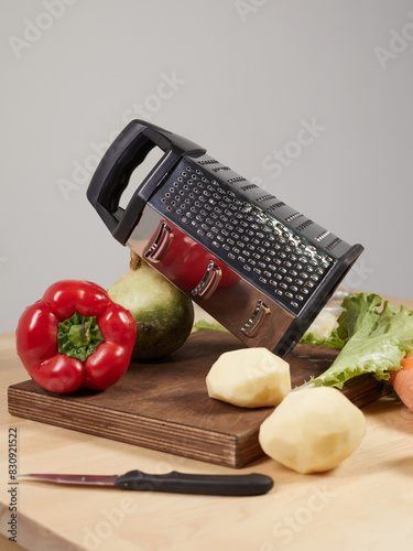 various vegetables around the grater