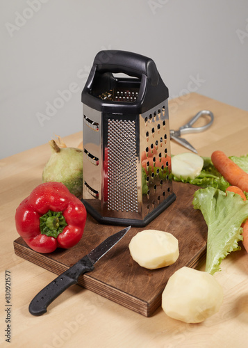 various vegetables around the grater