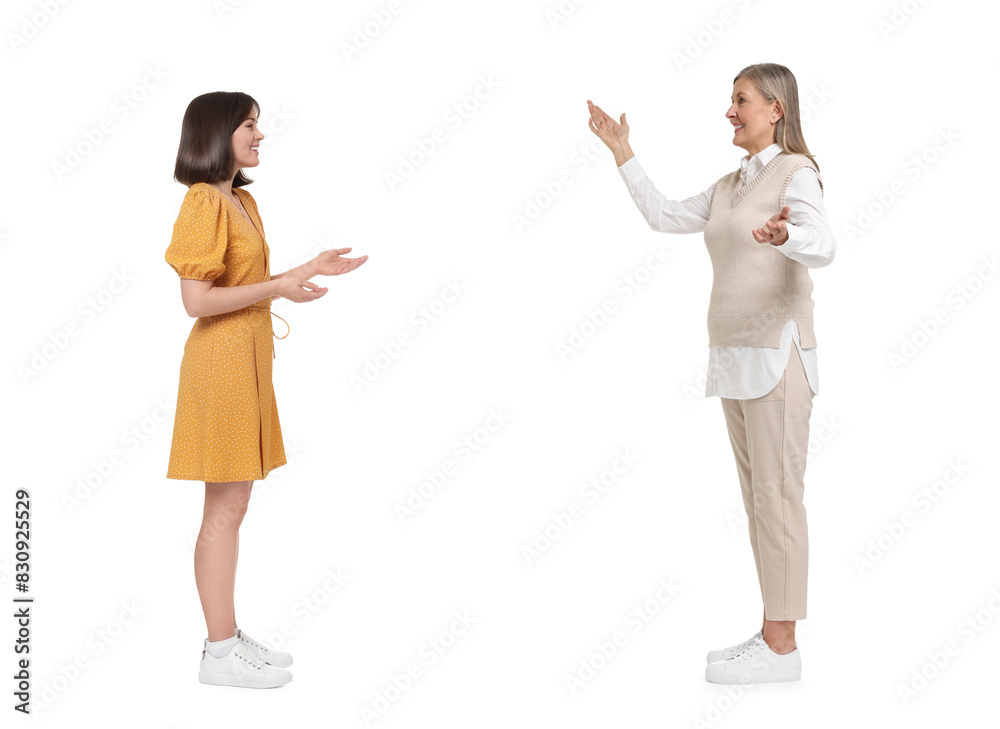 Two women talking on white background. Dialogue Two women talking on white background. Dialogue