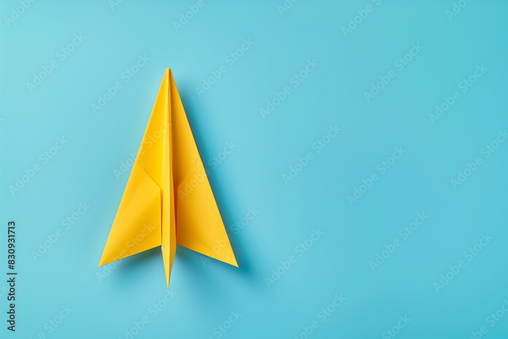 Yellow paper plane on blue background, Business competition concept. copy space
