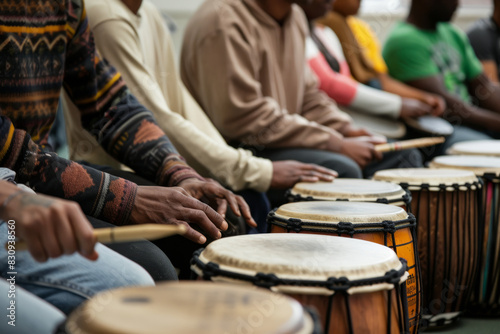 a multicultural drumming circle with participants playing various drums