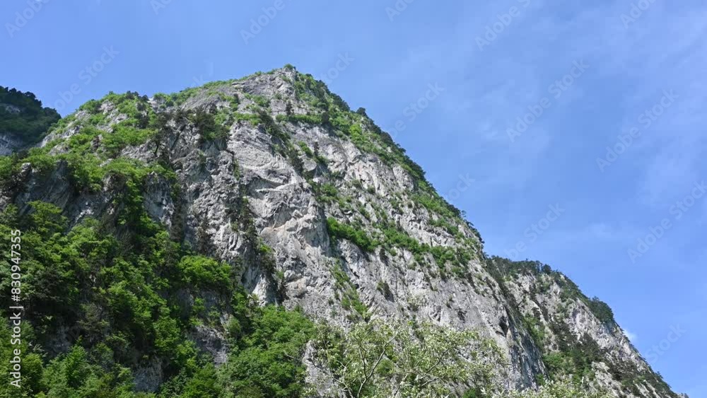 High cliffs. Accursed Mountains or Prokletije. Mountain range. Dinaric Alps in spring. Rocks on the mountain. High cliffs. Accursed Mountains or Prokletije. Mountain range. Dinaric Alps in spring. Rocks on the mountain.