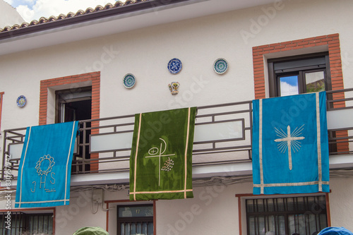 religious embroidered banner hanging decorating a balcony at a religious festival in Spain