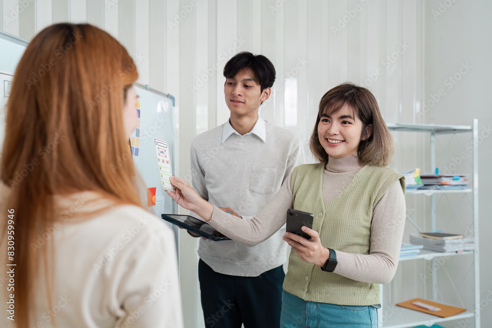 Obraz premium ux developer and ui designer brainstorming interface wireframe design.Creative digital development agency