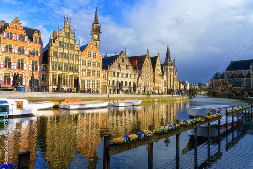Scenic view of the historical city center of Ghent (Gent), Belgium. Beautiful cityscape with medieval architecture, monumental landmarks and Lys river with tourist boats, outdoor travel background