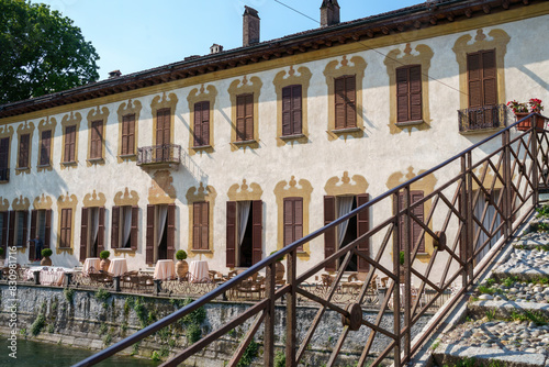 Historic buildings along the cycleway of Naviglio Grande, Milan, Italy, at Robecco photo