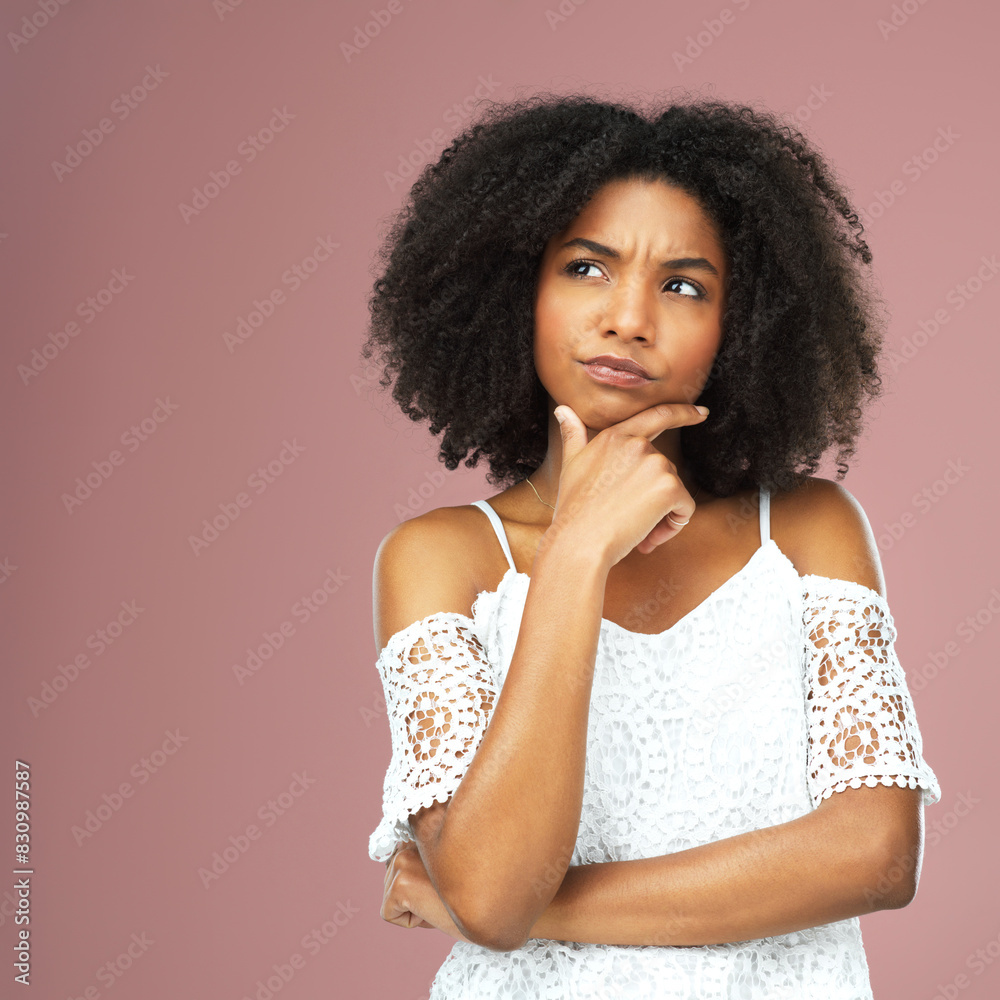 Black woman, thinking and questions for confused in studio with question, doubt and decision by problem solving for solution. African, female person and thoughtful with choice on pink background Black woman, thinking and questions for confused in studio with question, doubt and decision by problem solving for solution. African, female person and thoughtful with choice on pink background