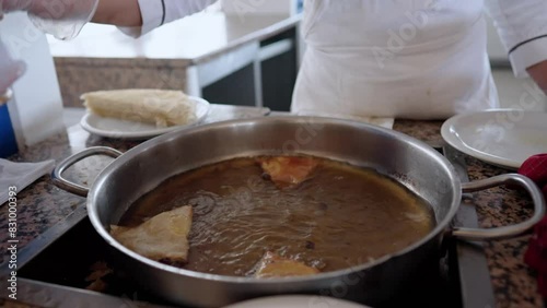 Wallpaper Mural Food is being fried in hot oil in a large pan on a stovetop. Process involves bubbling oil and delicious aromas Torontodigital.ca
