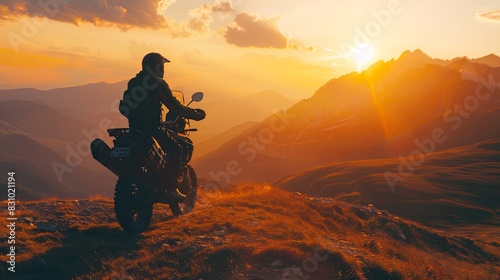 Silhouette of man biker and adventure motorcycle on the road with sunset light background. Top of mountains, tourism motorbike, vacation active lifestyle. Transfagarasan, Romania