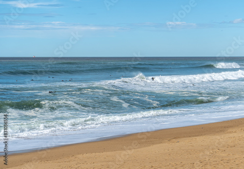 Surfers Sea Waves on Sandy Beach Texture Background, Transparent Ocean Water, Blue Sky, Sunny Shore