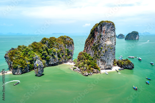 Khao Tapu, James Bond Island, aerial shot from a drone, blue sea, emerald green, is a popular tourist attraction in Southern Thailand. photo