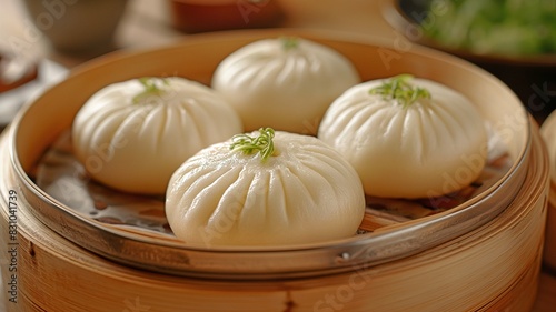 Close-up of delicious steamed buns served in a traditional bamboo steamer.