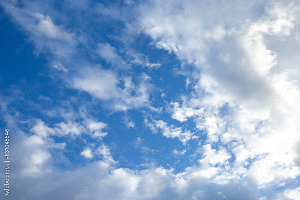 Bright sky texture background with white clouds, pleasing to the eye.