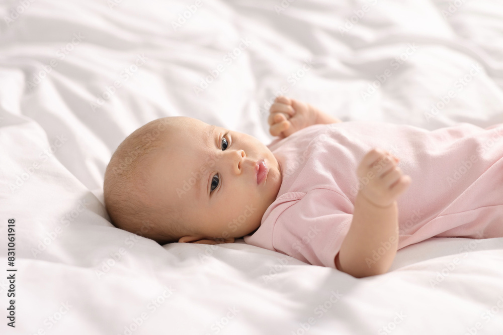 Cute little baby lying on white sheets Cute little baby lying on white sheets