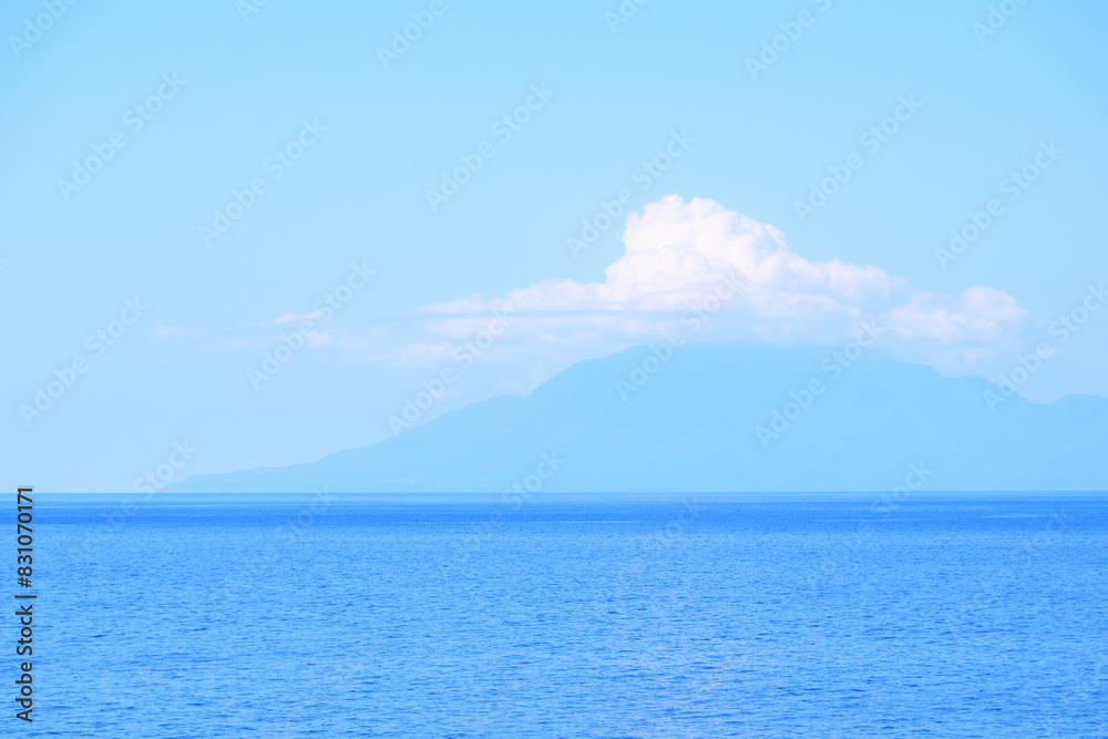 seascape with a cloudy mountain - mount Athos, Greece, aegean sea seascape with a cloudy mountain - mount Athos, Greece, aegean sea