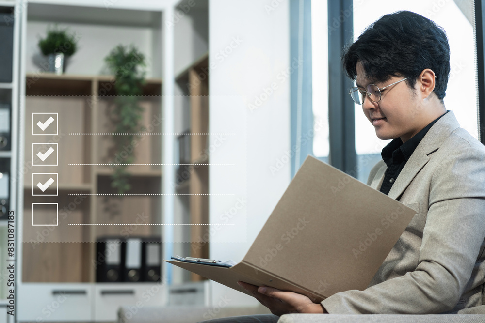 Fototapeta premium Businessman using chart tablet to do online checklist survey, doing assessment online survey answer test questions Digital form.