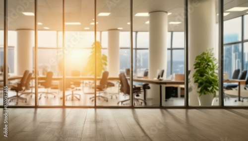 Blurred office interior background with panoramic windows and light from the window. Blurred office space with a business concept banner template