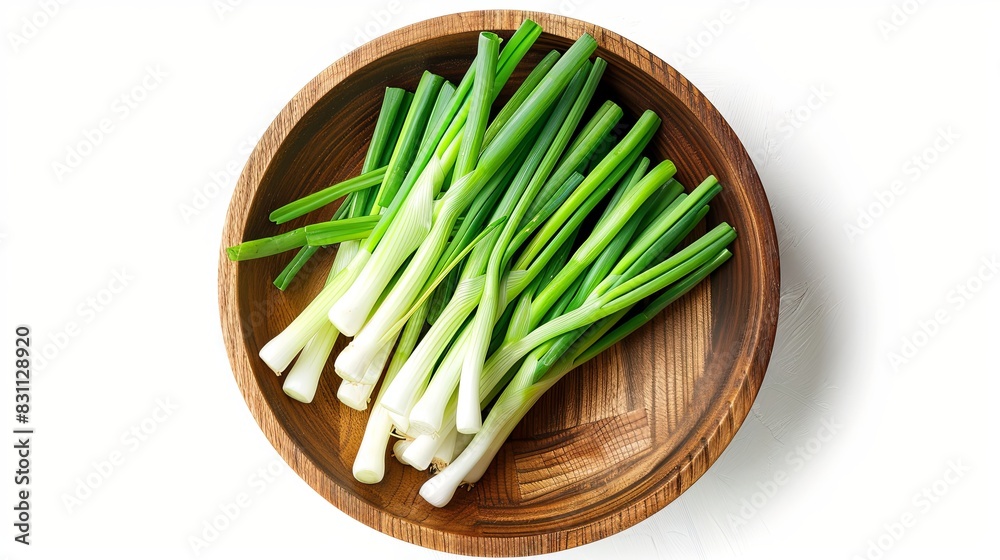 Green onion in wooden bowl isolated on the white background. Top view. Flat lay Green onion in wooden bowl isolated on the white background. Top view. Flat lay